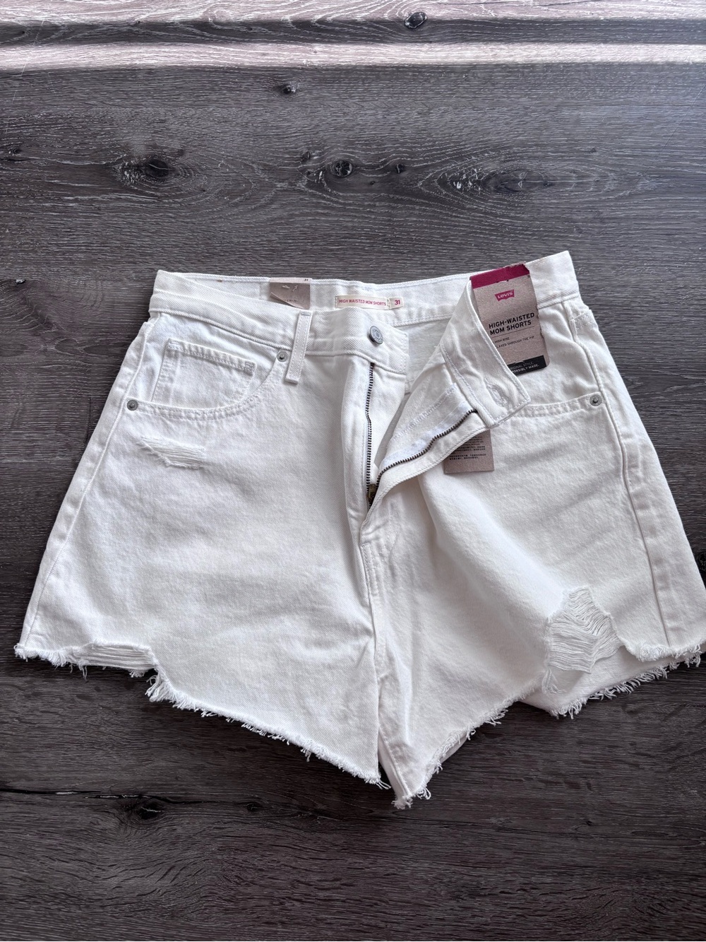 Levi’s High-Rise White Denim Mom Shorts - Distressed Hem